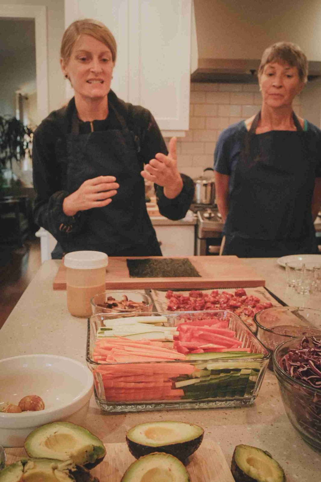 Danielle leading a hands on plant based kitchen lesson