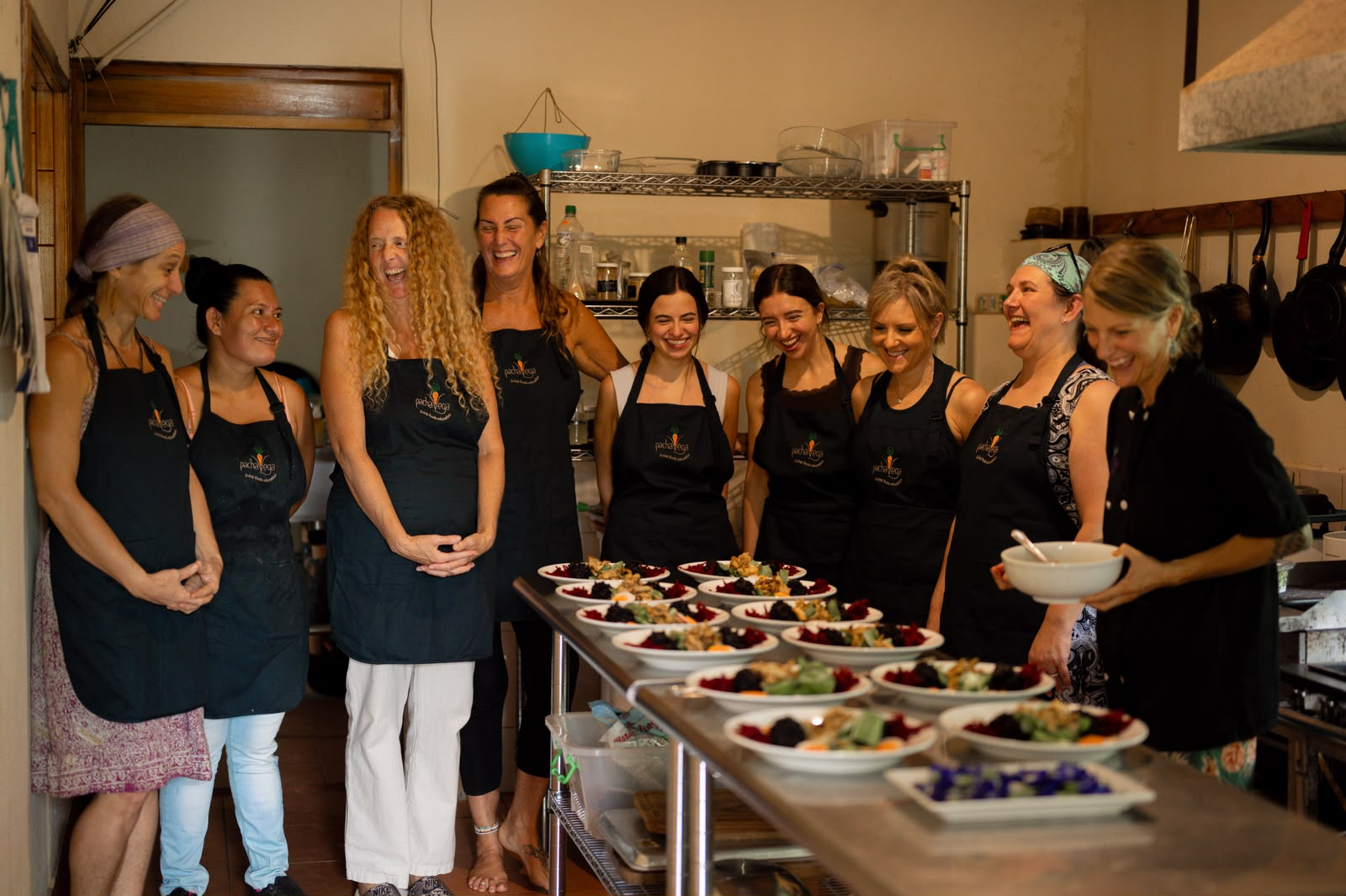 Guided Year students sharing a joyful moment in the Pachavega kitchen